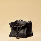 The Shoulder Bag IVY, crafted from supple, vegetable-tanned nappa leather, stands out for its artisanal detailing, distinctive side seams, and long braided handles. The interior lining and zippered side pocket are also made of fine nappa leather.
