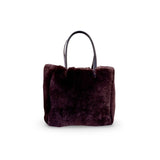 LABEL17 presents the reversible Shearling Bag called Shoulder Bag Shearling Reversible Snow in Darkbrown, Made in Switzerland