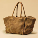 The Shoulder Bag ORIGINAL by LABEL17 is a timeless piece, crafted from fine, vegetable-tanned suede leather and hand-braided. It features a zipper closure and a convenient interior pocket for your essentials.