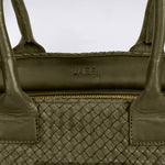 The Shoulder Bag ORIGINAL by LABEL17 is a timeless piece, crafted from fine, vegetable-tanned nappa leather and hand-braided. It features a zipper closure and a convenient interior pocket for your essentials.