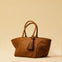The Shoulder Bag ORIGINAL by LABEL17 is a timeless piece, crafted from fine, vegetable-tanned nappa leather and hand-braided. It features a zipper closure and a convenient interior pocket for your essentials.