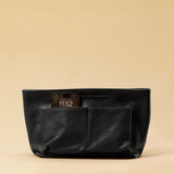 The Bag Organizer PENNY by LABEL17 is crafted from supple nappa leather and brings effortless style and order to large handbags. With integrated outer and inner compartments and a magnetic closure, it fits perfectly into our Shoulder Bag ORIGINAL.