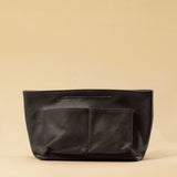 The Bag Organizer PENNY by LABEL17 is crafted from supple nappa leather and brings effortless style and order to large handbags. With integrated outer and inner compartments and a magnetic closure, it fits perfectly into our Shoulder Bag ORIGINAL.