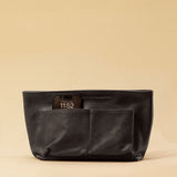 The Bag Organizer PENNY by LABEL17 is crafted from supple nappa leather and brings effortless style and order to large handbags. With integrated outer and inner compartments and a magnetic closure, it fits perfectly into our Shoulder Bag ORIGINAL.