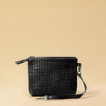 The Braided Pouch GAIA by LABEL17 is hand-braided from soft, vegetable-tanned nappa leather using an intricate braiding technique. Designed to carry your essentials, it features a leather strap with a carabiner, allowing you to wear it on its own or attach it seamlessly inside your LABEL17 bag.