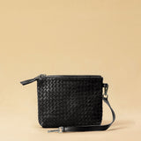 The Braided Pouch GAIA by LABEL17 is hand-braided from soft, vegetable-tanned nappa leather using an intricate braiding technique. Designed to carry your essentials, it features a leather strap with a carabiner, allowing you to wear it on its own or attach it seamlessly inside your LABEL17 bag.