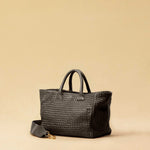 The Cabas Medium by LABEL17 is a lightweight handbag crafted from supple, vegetable-tanned nappa leather. Hand-braided and finished with a zip closure and detachable shoulder strap, it features a leather-lined interior with a secure inner pocket – combining refined design with everyday functionality. Handmade in Morocco.