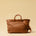 The Cabas Standard by LABEL17 is a larger version of the Cabas Medium – a lightweight handbag made from supple, vegetable-tanned nappa leather. Hand-braided, it features a zip closure, detachable shoulder strap, and a leather-lined interior with a secure inner pocket.
Spacious enough to fit your 14“ laptop in our Laptop Case 14 – perfect for a stylish everyday routine. Handmade in Morocco