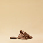 The Mule CHOUCHA by LABEL17 is crafted from supple, vegetable-tanned lamb nappa leather. A large, soft pompom sways elegantly with every step, adding a playful yet refined touch to the design. Handmade in Morocco.