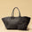 The Shoulder Bag ORIGINAL XL (Weekender) by LABEL17 is made from supple, vegetable-tanned nappa leather. The hand-braided leather bag can be made smaller on both sides from the inside with press studs and also includes a detachable, hand-braided pouch for organization inside the bag.