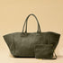 The Shoulder Bag ORIGINAL XL (Weekender) by LABEL17 is made from supple, vegetable-tanned nappa leather. The hand-braided leather bag can be made smaller on both sides from the inside with press studs and also includes a detachable, hand-braided pouch for organization inside the bag.