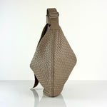 The LABEL17 Shoulder Bag Saddle Tresse is braided by hand and crafted from the most supple Nappa leather exemplifying luxury and durability. Designed with a unique saddle shape, it conforms seamlessly to your body. The bag is lined with leather and has practical compartments, including a zippered compartment for safe storage. Featuring a zipper and an adjustable shoulder strap, this versatile accessory offers the freedom to be worn over the shoulder or across the body.