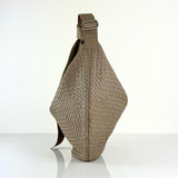 The LABEL17 Shoulder Bag Saddle Tresse is braided by hand and crafted from the most supple Nappa leather exemplifying luxury and durability. Designed with a unique saddle shape, it conforms seamlessly to your body. The bag is lined with leather and has practical compartments, including a zippered compartment for safe storage. Featuring a zipper and an adjustable shoulder strap, this versatile accessory offers the freedom to be worn over the shoulder or across the body.