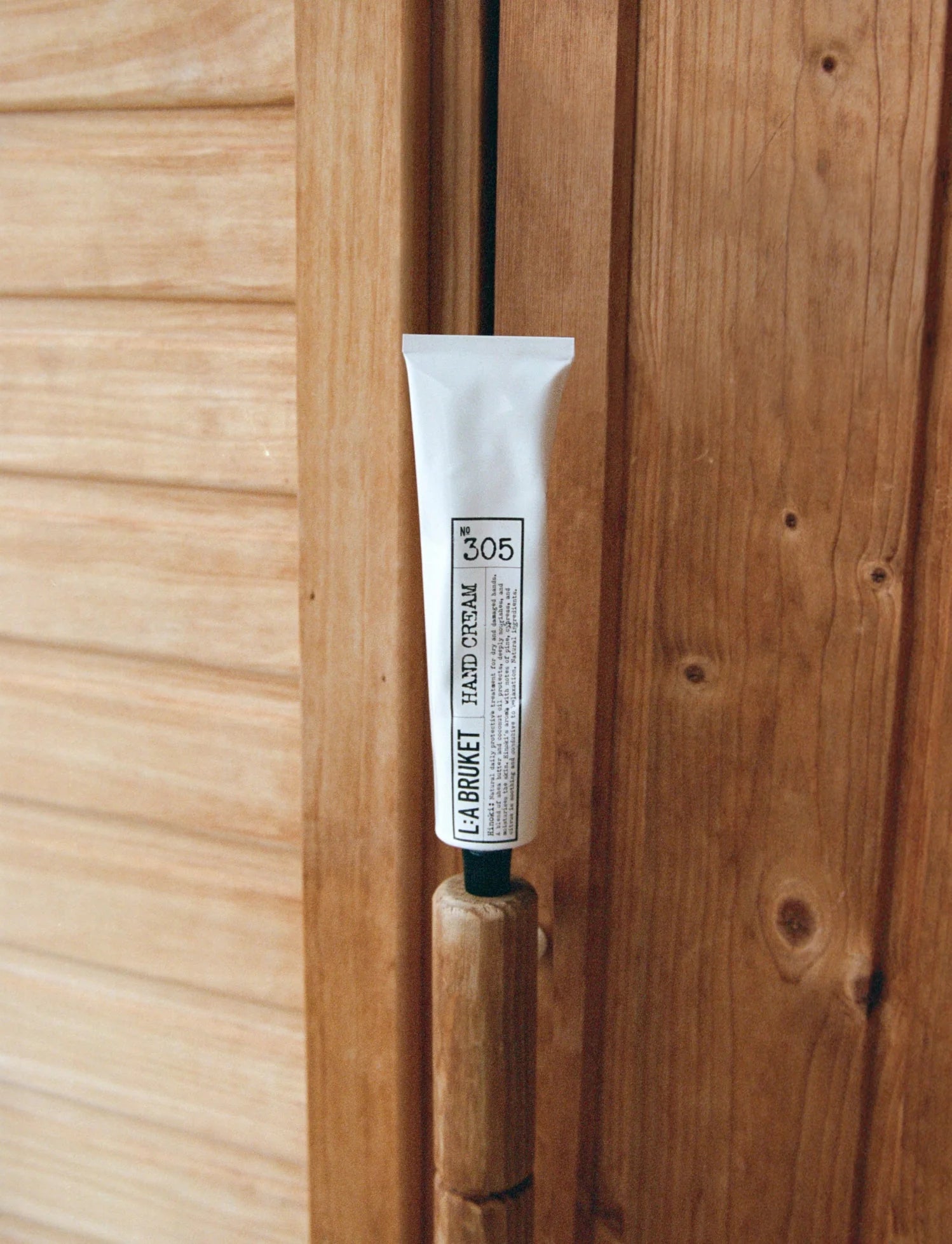 LA BRUKET's 305 Hinoki hand cream in a 70 ml tube. Produced in Sweden, available and in use at LABEL17 in Zurich Switzerland