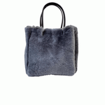 LABEL17 presents the reversible Shearling Bag called Shoulder Bag Shearling Reversible Snow in motion, Made in Switzerland